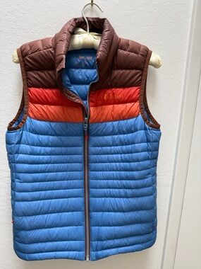 Cotopaxi women’s Fuego down Puffer Vest - Blue, Red & Brown.
